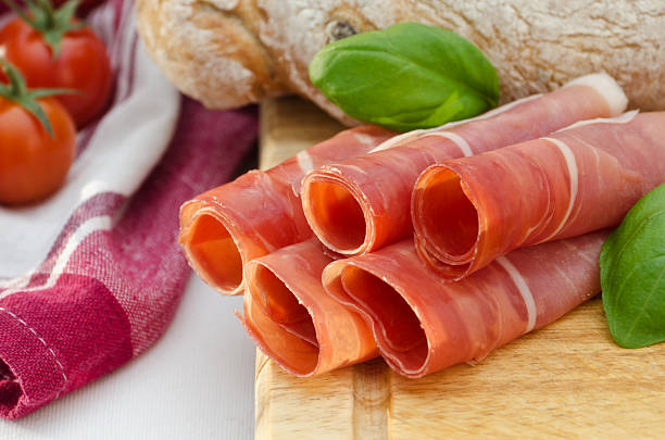 istock Rolls of ham garnished with tomotoes and basil 177122950