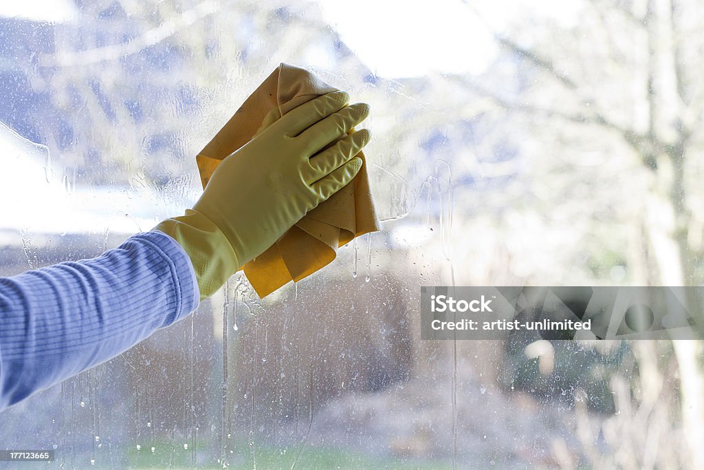 window cleaning man cleaning a window at home. spring cleaning. Window Washer Stock Photo