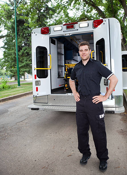 istock An EMT standing near an ambulance  177124322
