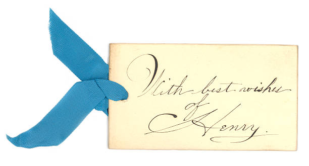 With Best Wishes of Henry A vintage gift tag with a blue ribbon. yellowed edges stock pictures, royalty-free photos & images