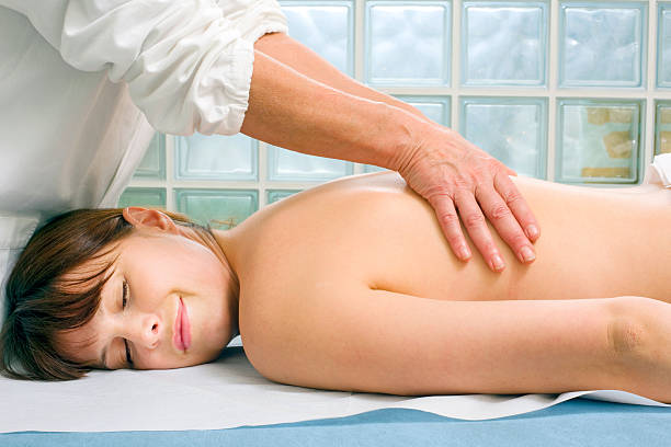 istock woman lying down receiving back massage 177124830