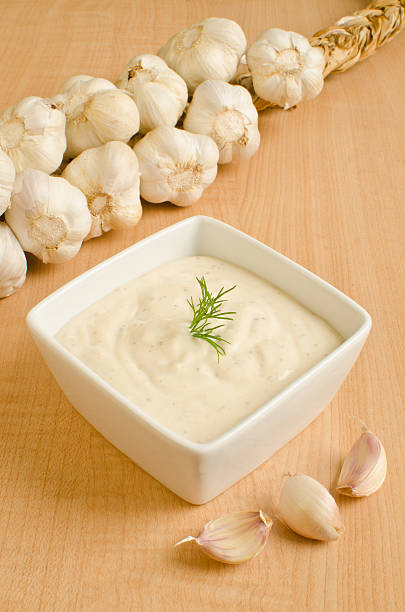 istock Garlic bulbs and a garlic dressing 177124854