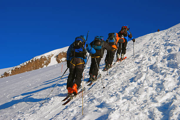 istock Rock-climbers walk up a mountain 177125117