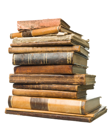 Stack of antique books isolated on white background