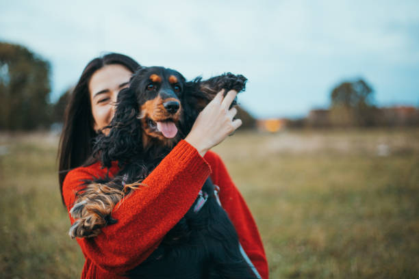 istock woman playing with dog 1771255476