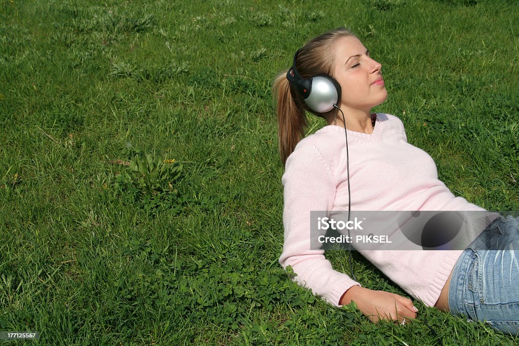 Young Woman Enjoying Music http://www.ufnal.pl/~bolek/feliks.szewczyk.info/foty/album35/people2.jpg Adult Stock Photo