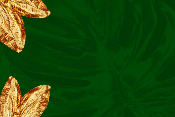 istock Tropical frame arranged exotic emerald background golden glitter leaves Wedding design 1771256185