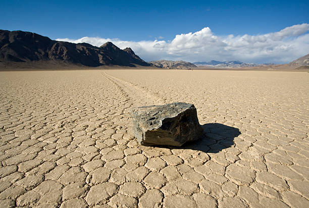 Racetrack Playa Large stones mysteriously skid across an ancient lakebed in Death Valley racetrack playa stock pictures, royalty-free photos & images