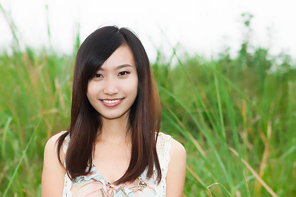 istock Young beautiful Asian woman looking at camera with smile 177127311