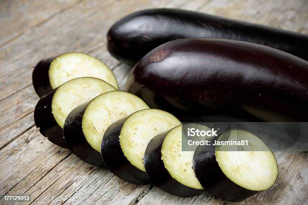 Eggplant On Wooden Table Stock Photo - Download Image Now - Crop - Plant, Eggplant, Food