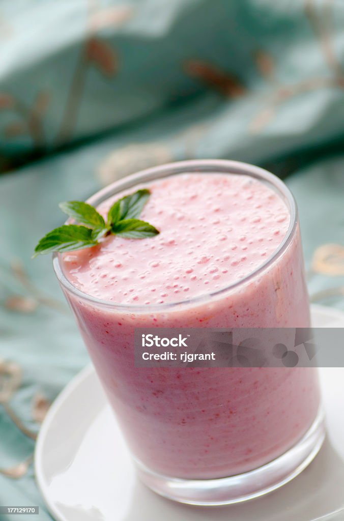 Strawberry Smoothie Glass of fresh fruit smoothie with sprig of mint Breakfast Stock Photo