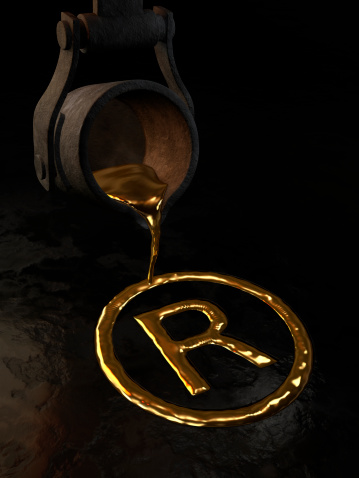 Molten gold - Trademark symbol. 3D image