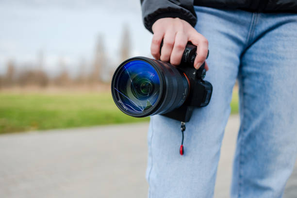istock DSLR camera with broken lens filter. Cracked photo-filter 1771303948