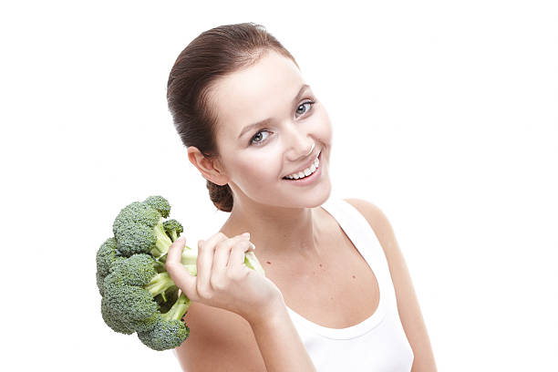 istock Young women with broccoli 177131269