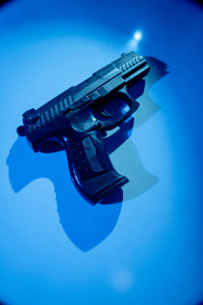 pistol gun artistic photo book cover design - police crime gun gang member imagens e fotografias de stock