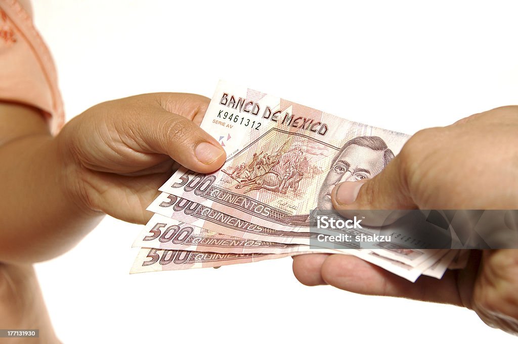 Money exchange Closeup of exchange of Mexican pesos between two persons on white background Mexican Pesos Stock Photo