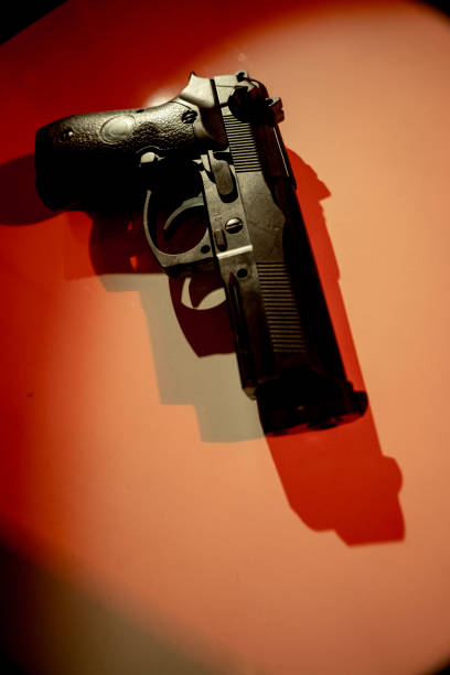 pistol gun artistic photo book cover design - police crime gun gang member imagens e fotografias de stock