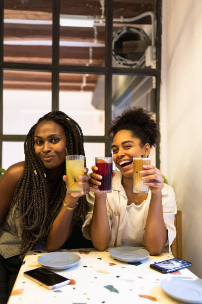 istock Cute multi-ethnic friends drinking cocktails in a bar 1771321762