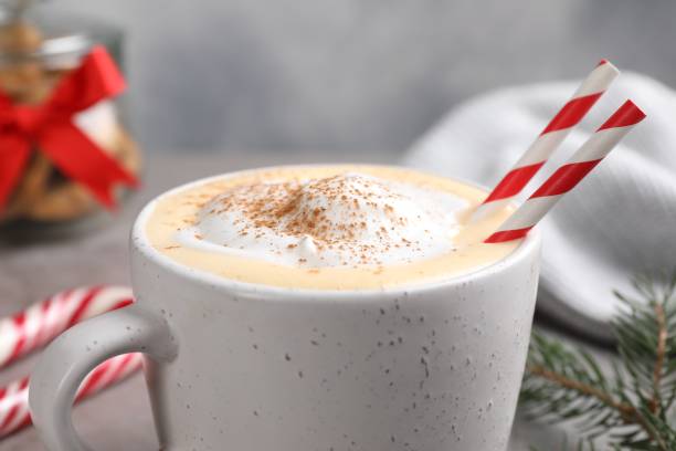 istock Cup of delicious eggnog with cinnamon on table, closeup 1771325562