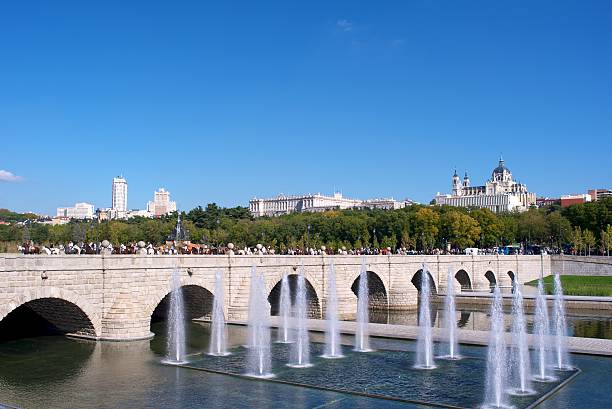 Fountain by the Toledo Bridge on Madrid Rio with the Cathedral behind
