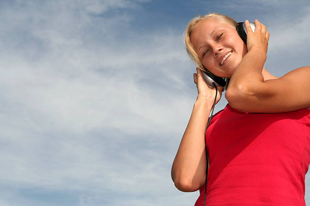 istock Beautiful Woman Enjoying Music 177133045