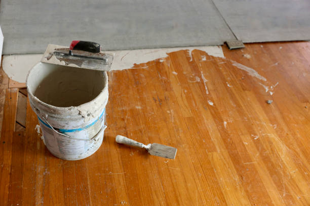 istock Adhesive and trowel for installing the new floor 1771341750