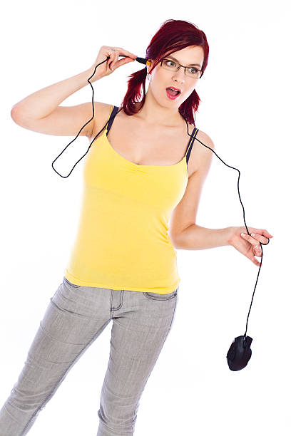 Woman playing with a computer mouse stock photo