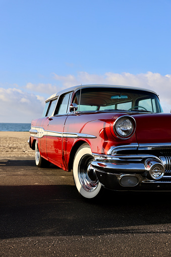 1950s surfer wagon parked at the beach