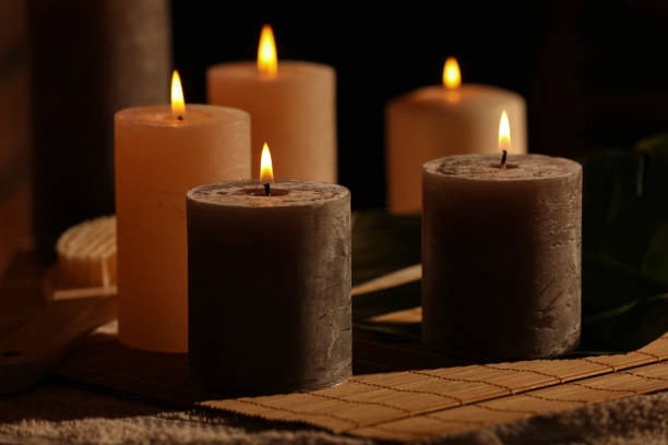 istock Spa composition with burning candles on massage table in wellness canter, closeup 1771350343