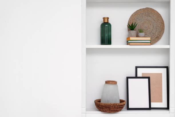 istock Shelves with different decor near beige wall, space for text. Interior design 1771353153