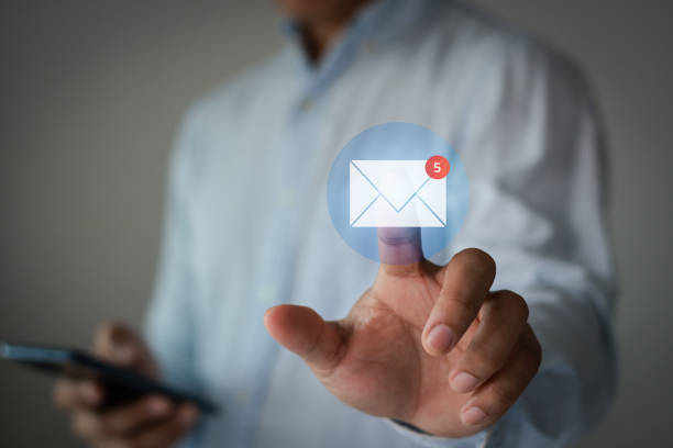 istock Email marketing concept. Business people hand touch new mail notification icon. For communication and digital campaign information, contact us by newsletter. Inbox receives electronic message alerts. 1771353669
