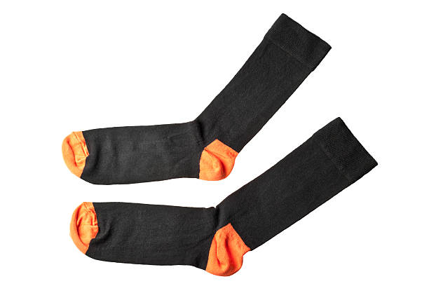 istock pair of black and orange sock isolated on white background 177135648