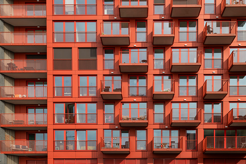 Modern red colored apartments in the new NDSM district in Amsterdam.