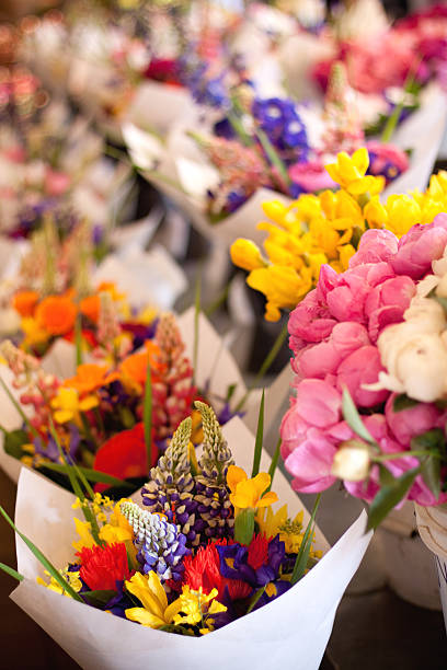 Photo of a flower stand with lots of colorful flowers and bouquets in Mexico City, Mexico