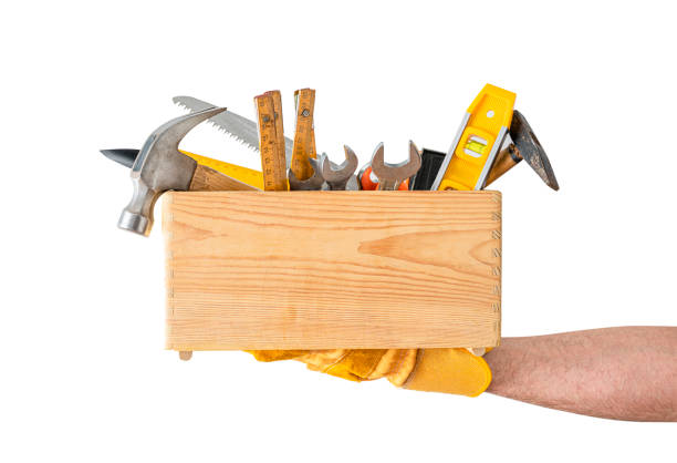 Repairman holding a toolbox , isolated on white background