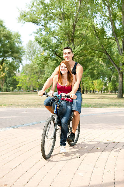 istock happy couple riding on a bicycle 177136798