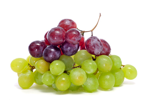 closeup of some bunchs of grapes on a white background