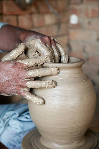 istock potter's hands giving shape to terracotta vase 177137559