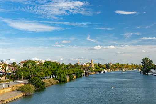 view from Triana over the Guadalquivir river to the center of Seville in Andalusia