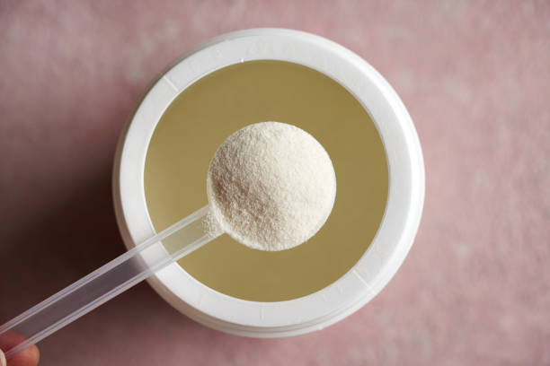 istock Collagen powder in a plastic scoop above a plastic jar 1771378773