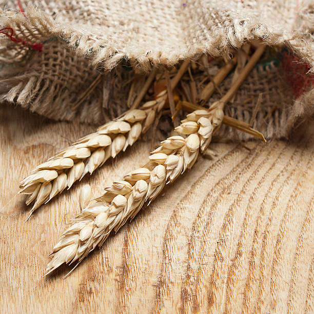 istock Whole wheat on a wooden table 177138252