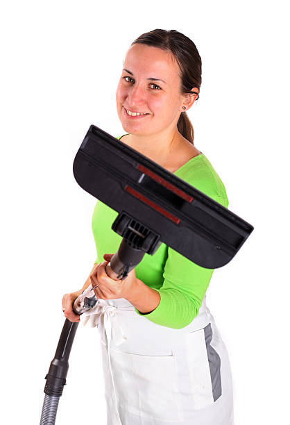 istock Young woman with vacuum cleaner 177138282