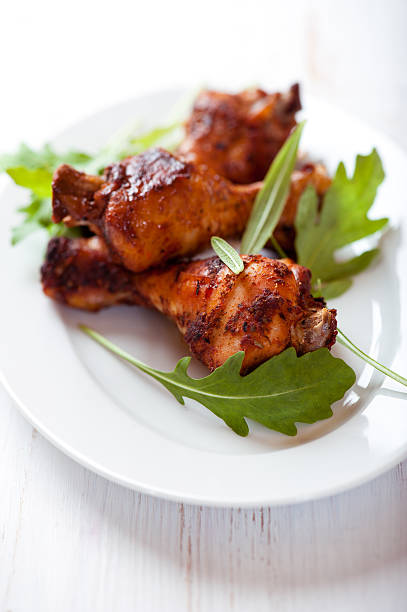 istock Roasted chicken legs with rocket leaves 177138428