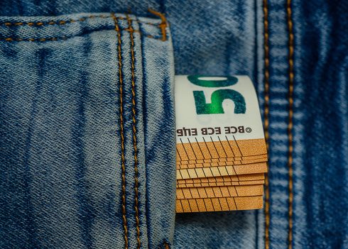 Aizkraukle /Latvia ;09.09.2023-Euro bills of 50 euros in the pocket of blue jeans, studio shooting 8