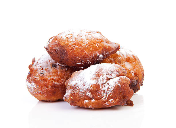 pile of dutch donut also known as oliebollen - oliebollen stockfoto's en -beelden