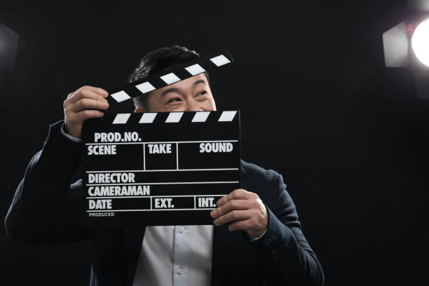 istock Asian actor with clapperboard on stage, space for text. Film industry 1771394524