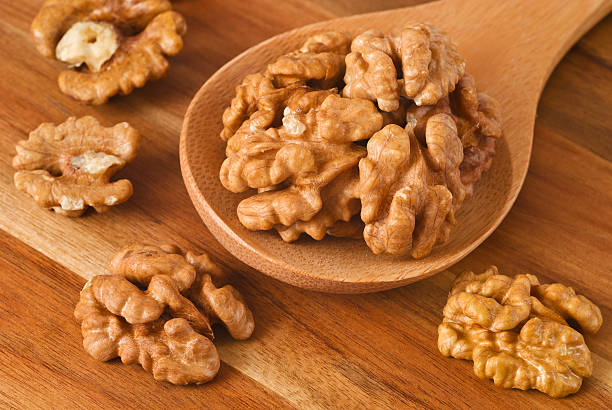 istock Walnuts in wooden spoon 177139554