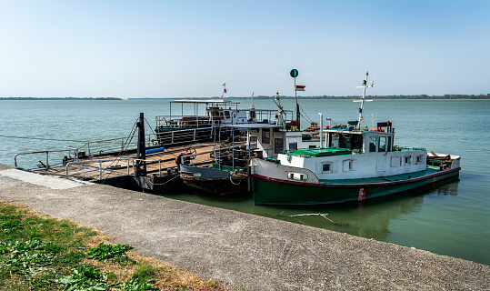 Fishing boats docked at the river bank