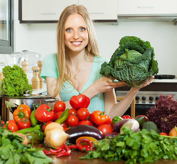 istock happy housewife  with raw cabbage in home kitchen 177141288