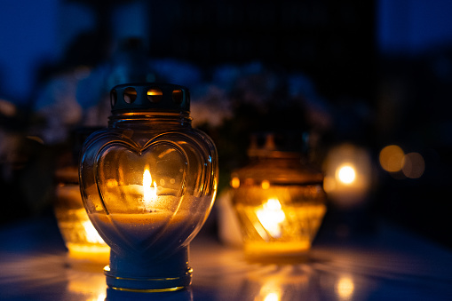 Lanterns in the cemetery at night. Selective focus.All saint’s day